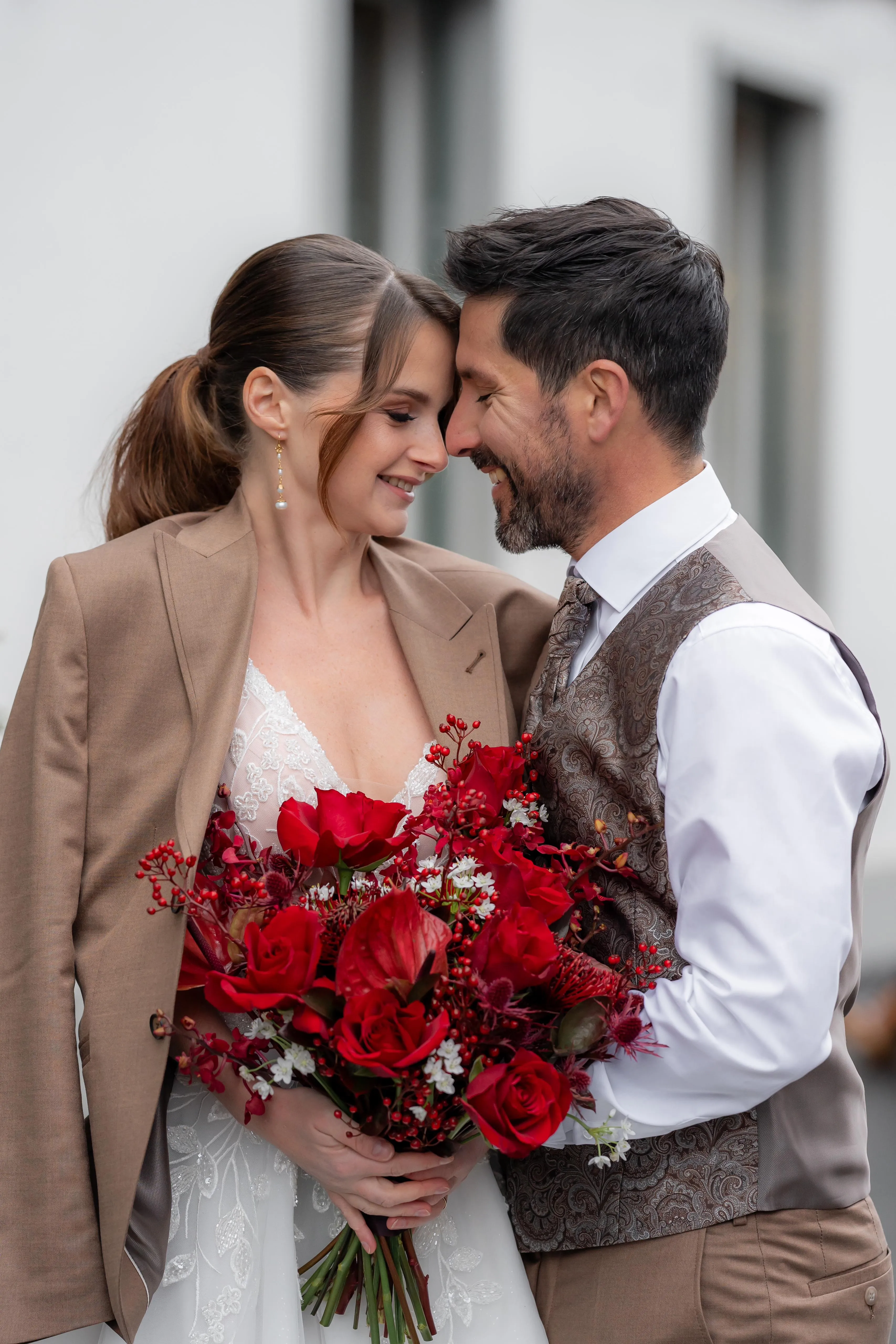 center image of a couple with their wedding bouquet 